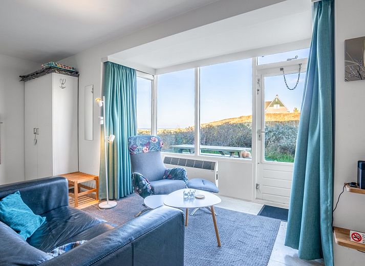 Cozy living room in Apartment Juliana 068 Island and Sea View, De Koog, Texel with beautiful views of the dunes.