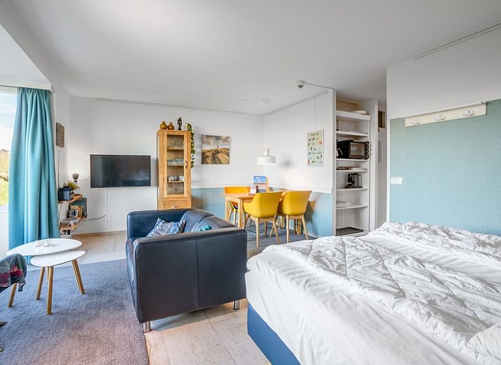 Bright interior space of Apartment Juliana 068 Island and Sea View, De Koog, Texel with comfortable seating.