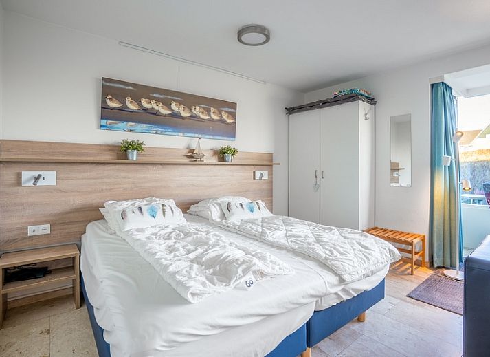 Bright interior space of Apartment Juliana 068 Island and Sea View, De Koog, Texel with comfortable seating.