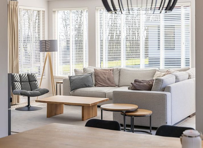 Villa 8 in De Koog, Texel, offers a spacious vacation home with sunny terrace and green garden, ideal for a relaxing stay on the Wadden Islands.