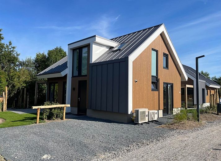 Stylish interior of Duinvilla Wellness 4, vacation home in De Koog, Texel with comfortable seating area.