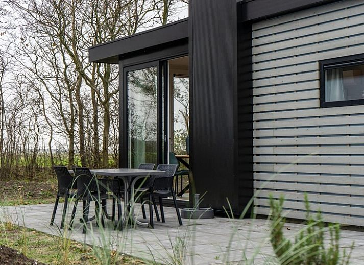 Gemuetliches Wohnzimmer des Pavillons 4 in De Koog, Texel mit bequemen Sitzgelegenheiten.