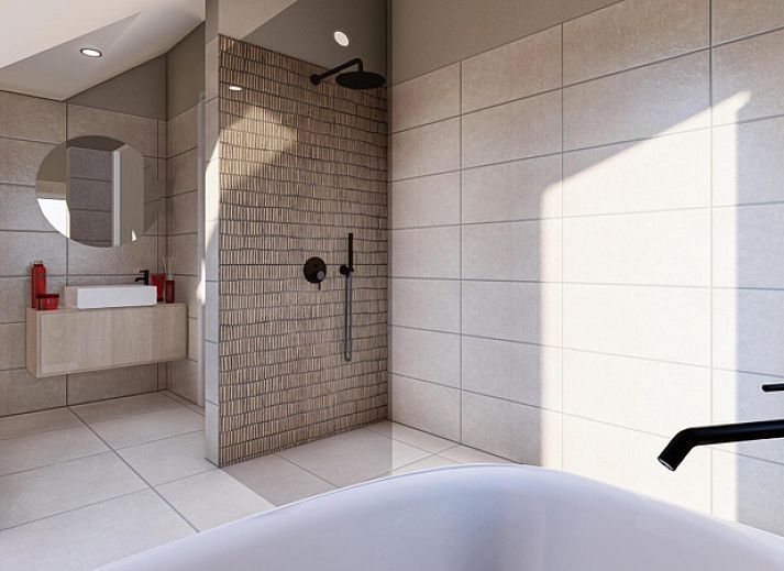 Bright living room in Duinvilla Wellness 6, Texel, with comfortable sofa and wooden wall decoration.