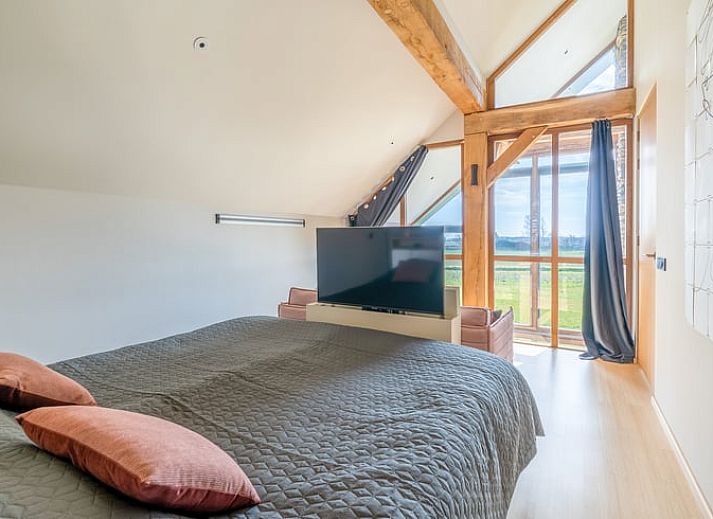 Modern living room with high ceilings in Holiday home in De Koog Texel, perfect for a luxurious stay on the Wadden Islands.