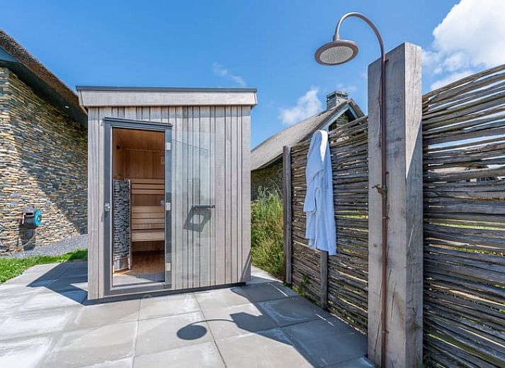 Stylish living room with open kitchen in Holiday home in De Koog Texel, ideal for a relaxing vacation on the Wadden Islands.