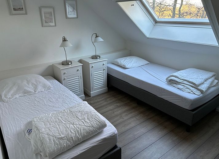 Cozy living room of Stormvogel, vacation home in De Koog, Texel with comfortable seating area.