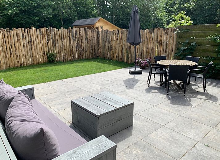 Cozy living room of Stormvogel, vacation home in De Koog, Texel with comfortable seating area.