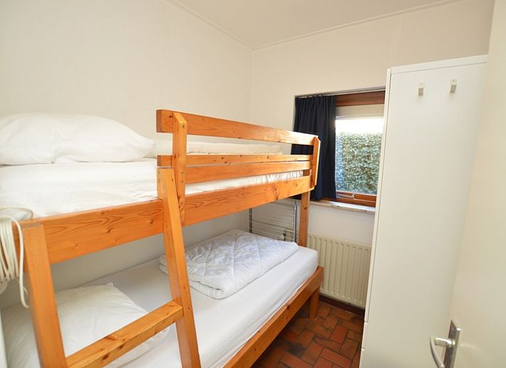 Gemuetliches Wohnzimmer von Orchismient 18 klein in De Koog Texel mit bequemen Sitzgelegenheiten.