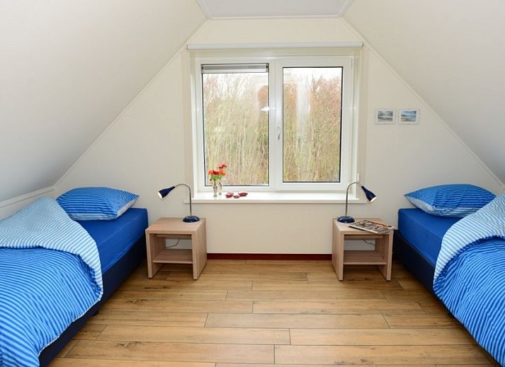 Duinrand Holiday Villas Type 1 in De Koog Texel with driveway and dune landscape.