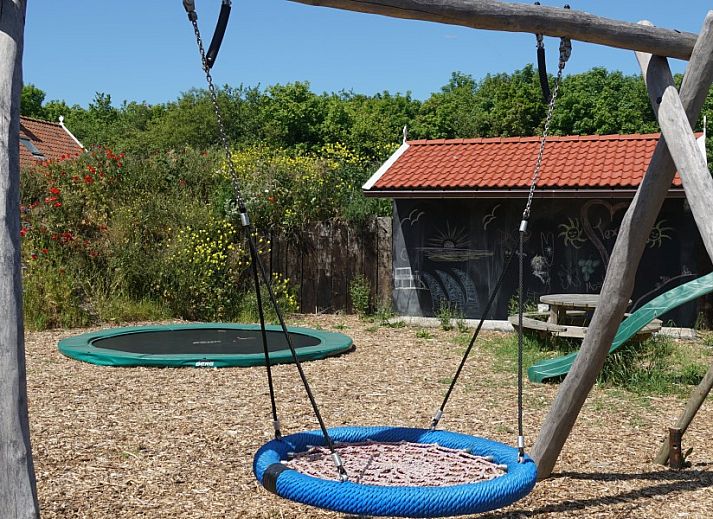 Duinrand Holiday Villas Type 1 in De Koog Texel with driveway and dune landscape.