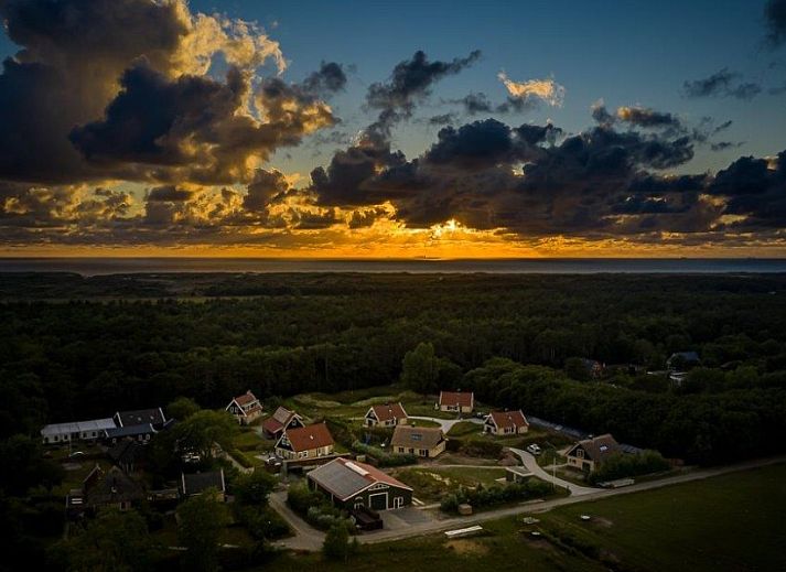Side view of Duinrand Holiday Villas Type 1 in De Koog Texel with flowering garden.