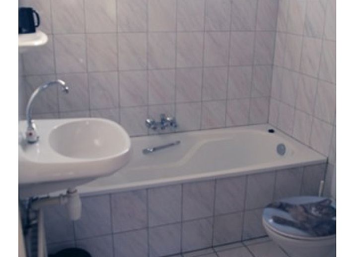 De Kemphaan: Bungalow in De Waal, Texel met zonnig terras en groene tuin voor ontspanning.