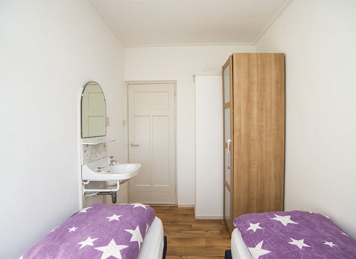 Sheep graze around Huisje Schiller - 4883, an idyllic vacation home in De Waal, Texel.