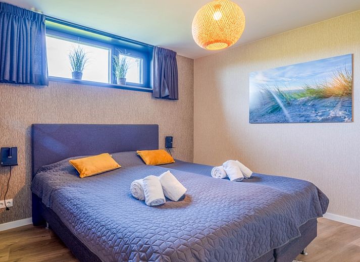 Stijlvolle woonkamer van Villa 24 Oosterkolk in De Waal, Texel met comfortabele zithoek.