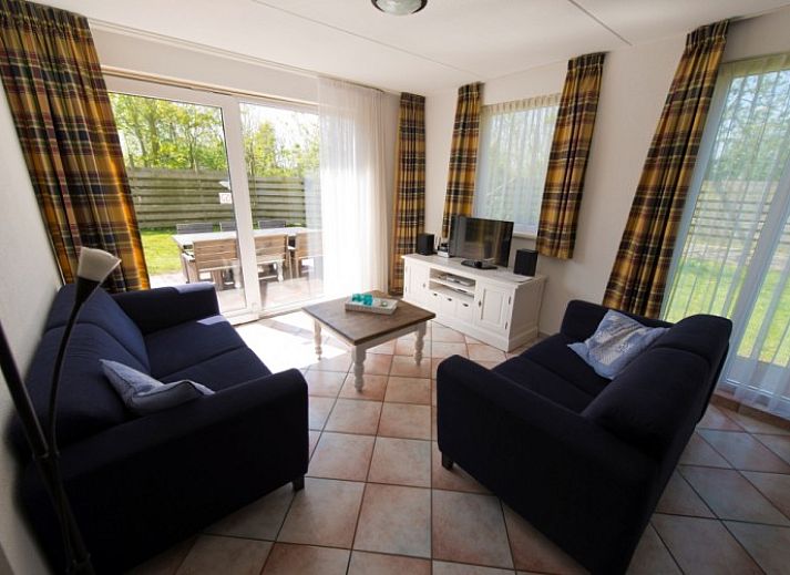 Bungalow De Boogerd in De Waal, Texel with spacious garden and terrace, ideal for a relaxing stay on the Wadden Islands.