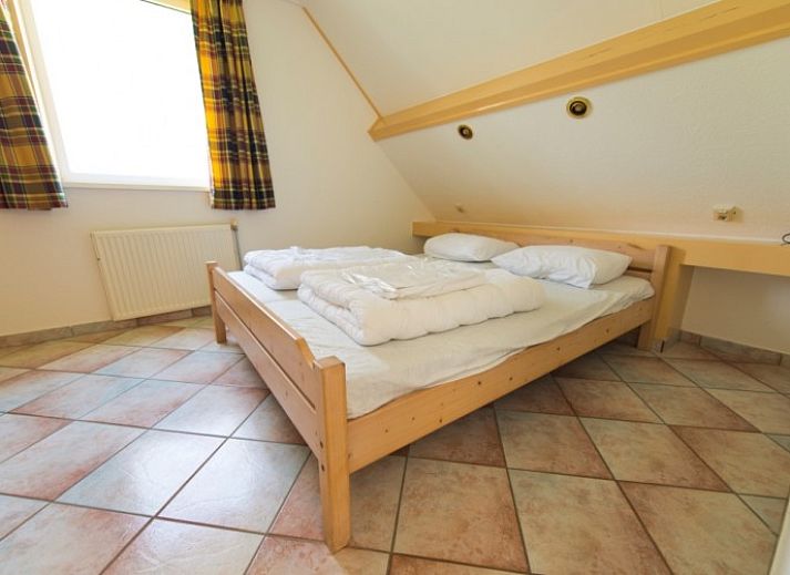 Bungalow De Boogerd in De Waal, Texel with spacious garden and terrace, ideal for a relaxing stay on the Wadden Islands.