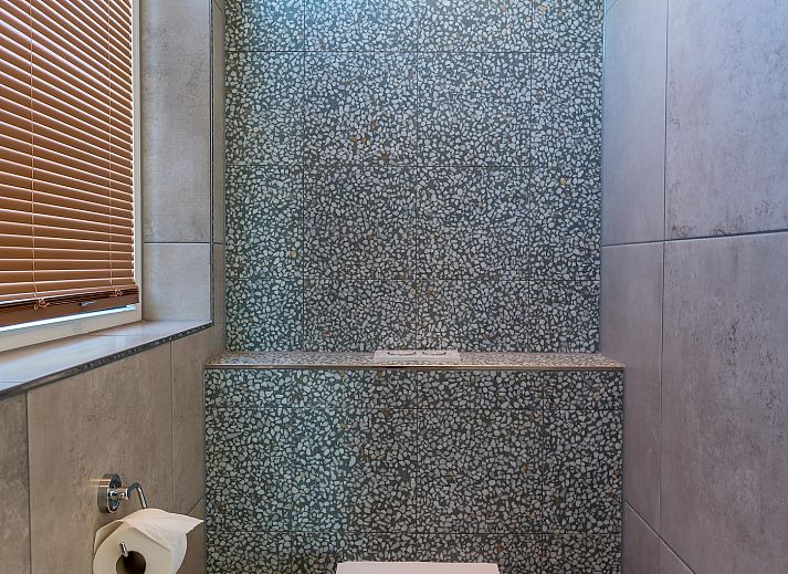 Gemuetliche Sitzecke mit Flachbildschirm im Ferienhaus Bruine Kiekendief, Den Burg Texel.