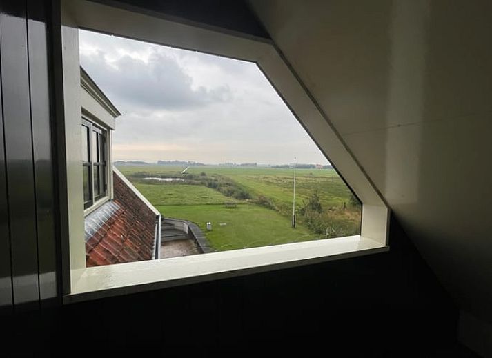Bright and spacious living room in Cottage in Den Burg, Texel, perfect for relaxation.