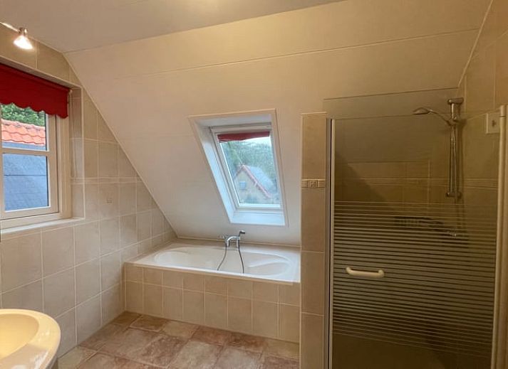 Bright and spacious living room in Cottage in Den Burg, Texel, perfect for relaxation.