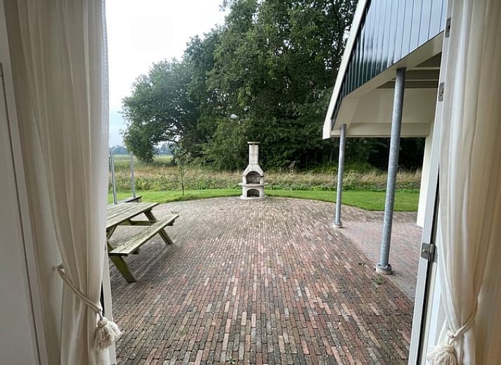 Modern living room with flat screen in Cottage in Den Burg, Texel, ideal for family gatherings.
