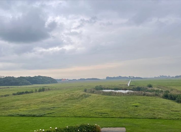 Modern living room with flat screen in Cottage in Den Burg, Texel, ideal for family gatherings.