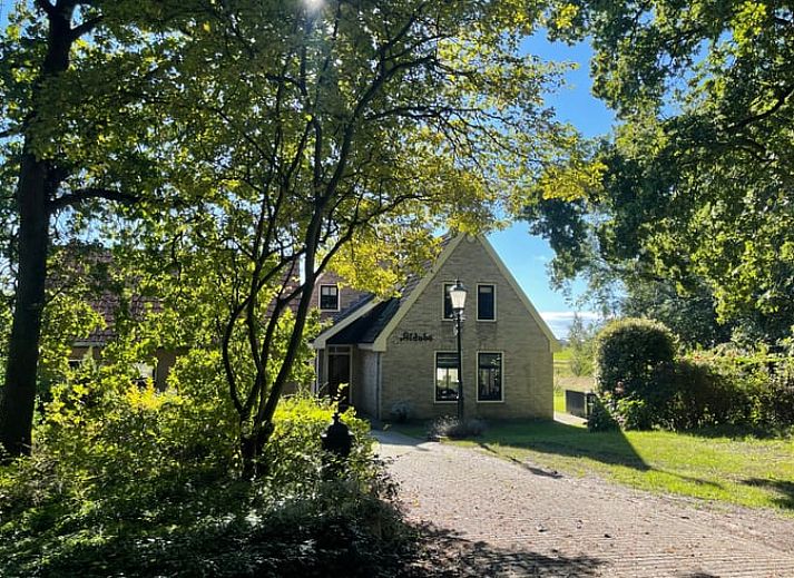 Modern living room with flat screen in Cottage in Den Burg, Texel, ideal for family gatherings.