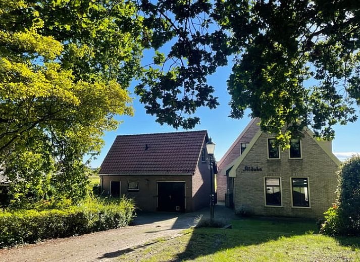 Modern living room with flat screen in Cottage in Den Burg, Texel, ideal for family gatherings.
