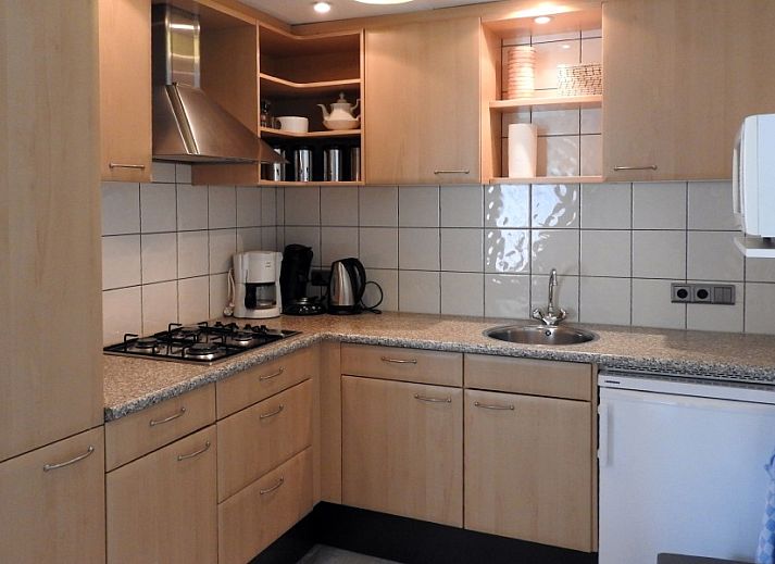 Familie Smit bungalow in Den Burg Texel met kleurrijke tuin en bloemenpracht.