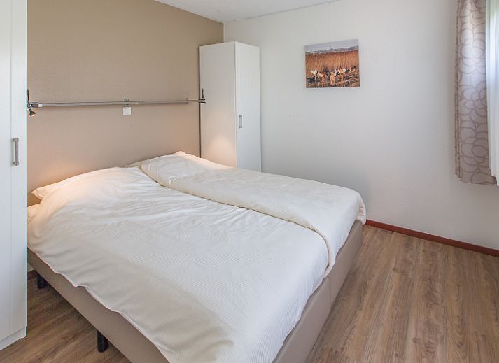 Slingerhuusie vakantiehuis in Den Burg Texel met zonnig terras en groene tuin