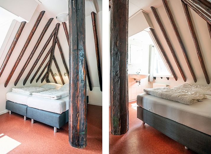 Cozy living room of Apartment De Koolmees, Den Burg, Texel, with comfortable sitting area and dining area.