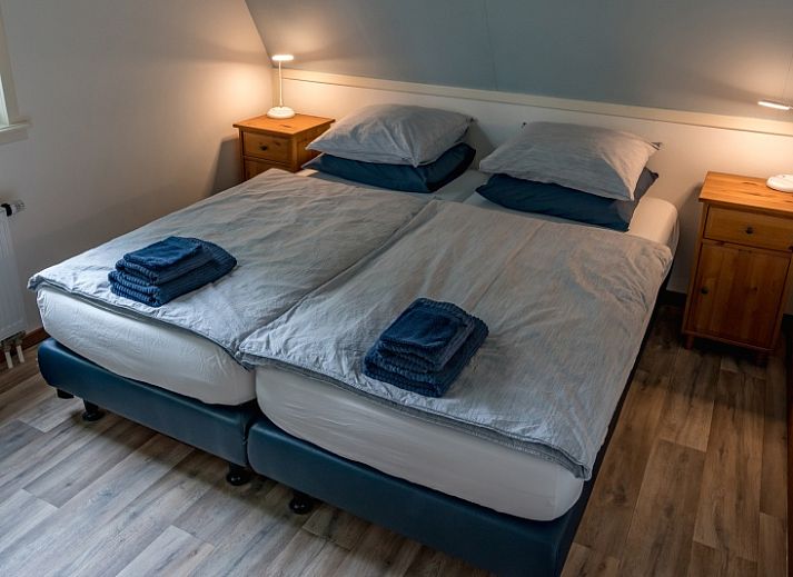 Gemuetliches Wohnzimmer im Ferienhaus Eelman B. 1405 Den Burg Texel mit komfortabler Sitzecke.