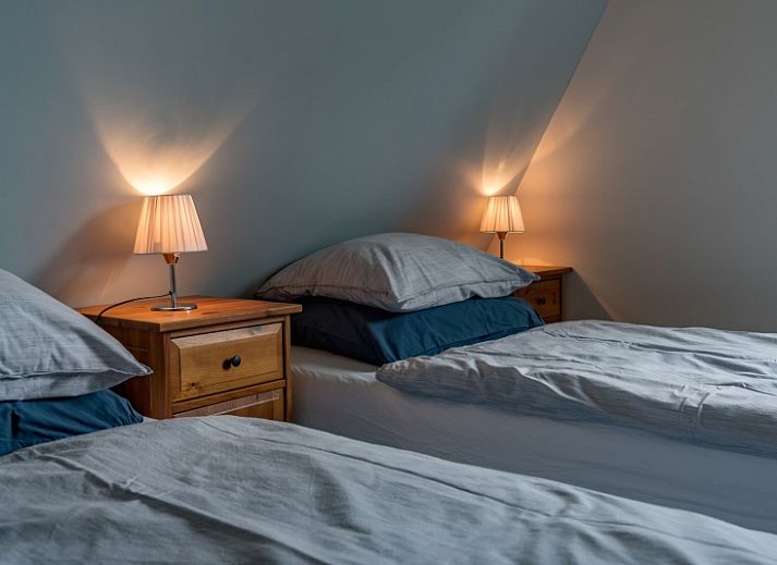 Gemuetliches Wohnzimmer im Ferienhaus Eelman B. 1405 Den Burg Texel mit komfortabler Sitzecke.