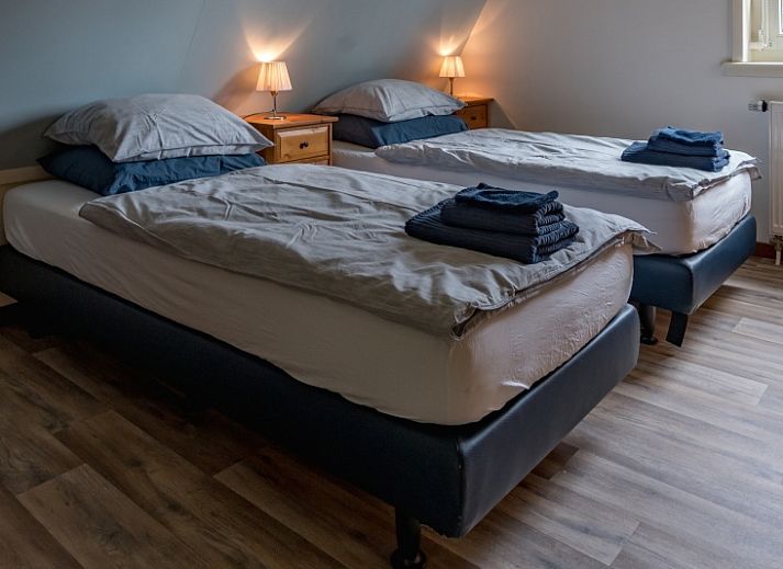 Gemuetliches Wohnzimmer im Ferienhaus Eelman B. 1405 Den Burg Texel mit komfortabler Sitzecke.