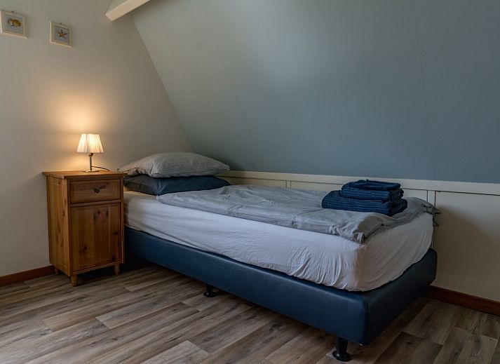 Gemuetliches Wohnzimmer im Ferienhaus Eelman B. 1405 Den Burg Texel mit komfortabler Sitzecke.