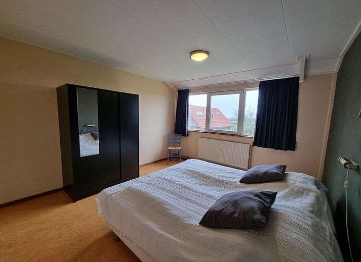 Veranda of Holiday home Westzicht in Den Burg Texel with green surroundings.