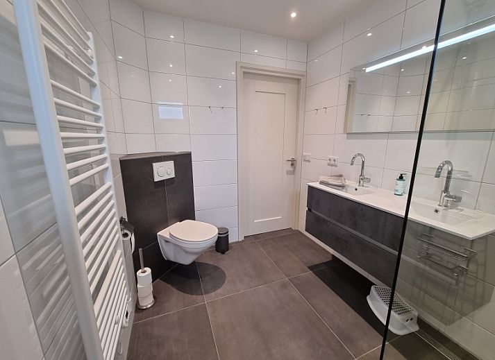 Modern kitchen and living room in Schoonoordsingel 29a, vacation home in Den Burg, Texel.