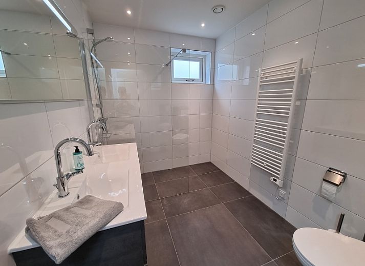 Modern kitchen and living room in Schoonoordsingel 29a, vacation home in Den Burg, Texel.