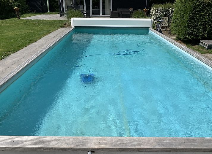 Gemuetliches Wohnzimmer im Bungalow 3B, Den Burg, Texel mit komfortabler Sitzecke und moderner Einrichtung.