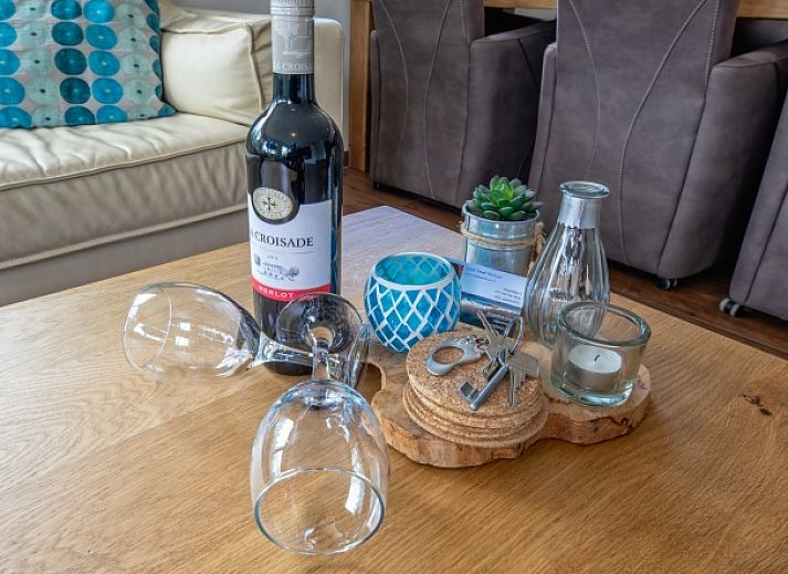 Sunny terrace at Villa 3C in Den Burg, Texel overlooking the pool, perfect for a relaxing vacation.