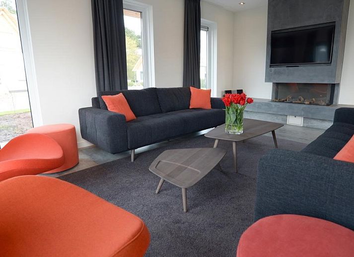 Roggesloot vakantiehuis in Den Burg, Texel met zonnig terras en groene tuin.