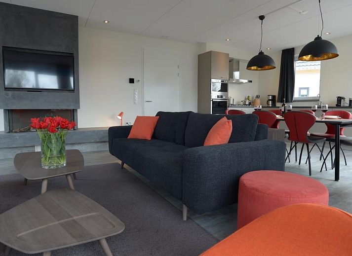 Roggesloot vakantiehuis in Den Burg, Texel met zonnig terras en groene tuin.