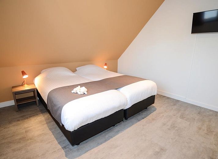 Comfortabele zithoek in Roggesloot vakantiehuis, Den Burg, Texel met open haard.