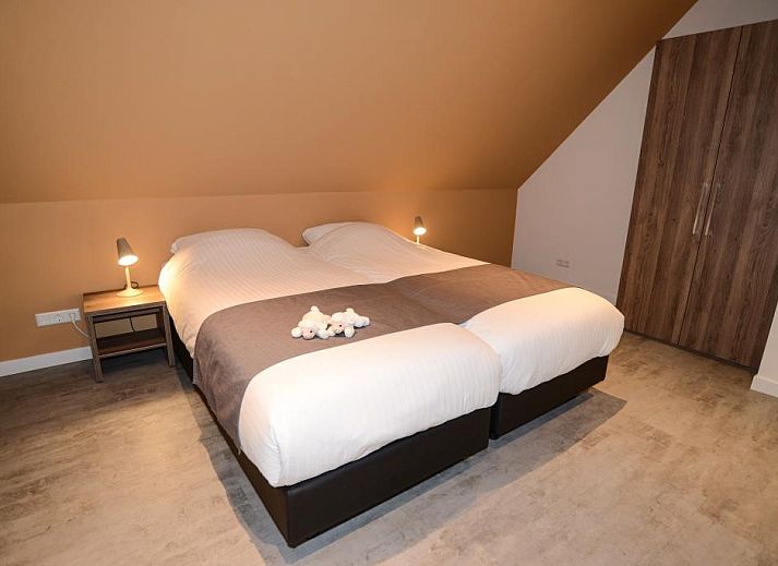 Comfortabele zithoek in Roggesloot vakantiehuis, Den Burg, Texel met open haard.