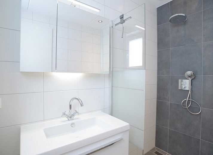 Comfortabele zithoek in Roggesloot vakantiehuis, Den Burg, Texel met open haard.