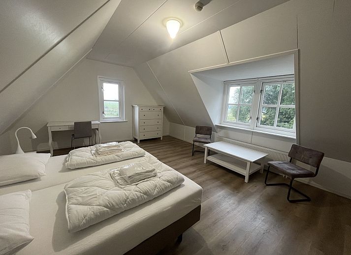 Moderne woonkamer in 44 - Aldubo Landhuis, Den Burg, Texel, met stijlvolle inrichting.