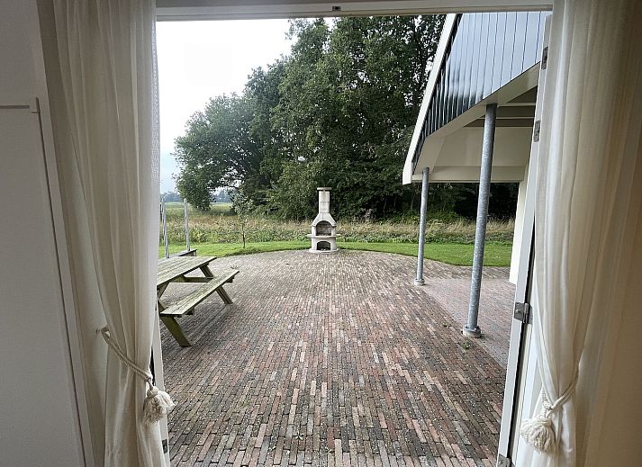 Moderne woonkamer in 44 - Aldubo Landhuis, Den Burg, Texel, met stijlvolle inrichting.