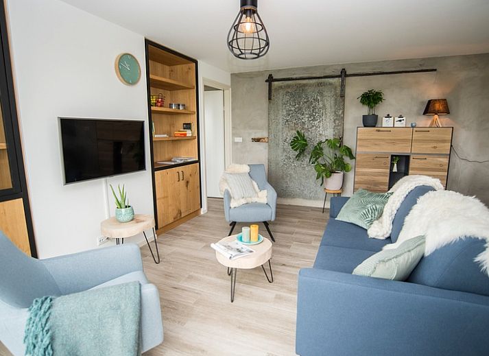 Onder de Wol vakantiehuis in Den Burg, Texel met charmant terras en groene omgeving.