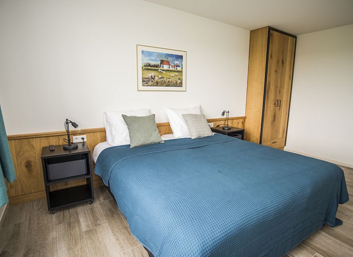 Gezellige zithoek in Onder de Wol vakantiehuis Den Burg, Texel met comfortabele meubels.