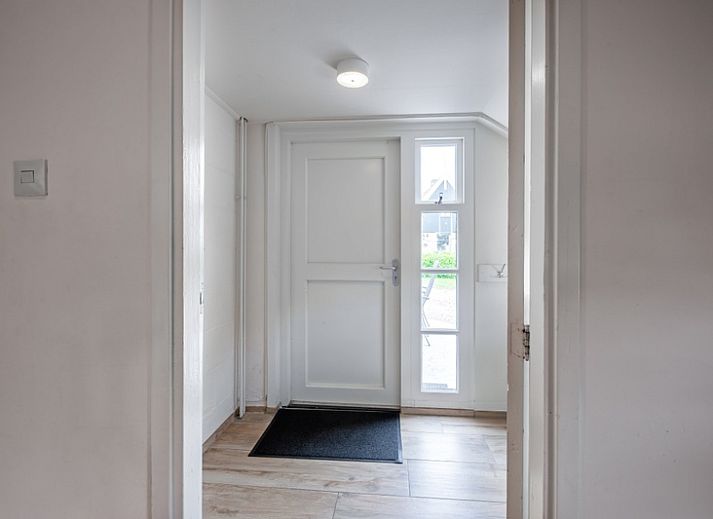 Terrasse des Appartements Gouden Reaal 26 in Den Hoorn, Texel, mit Sitzecke