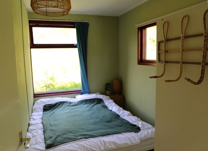 Gemuetlicher Innenbereich des Ferienhauses Vogelsand in Den Hoorn Texel mit Sitzecke und Essbereich.